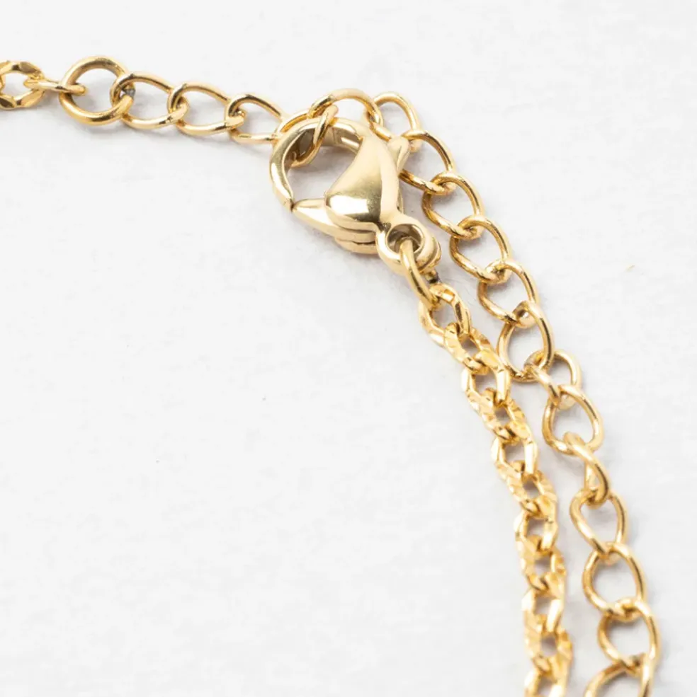 Bracelet en acier doré et blanc - trefle