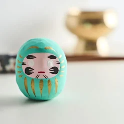Petit daruma turquoise réussite scolaire